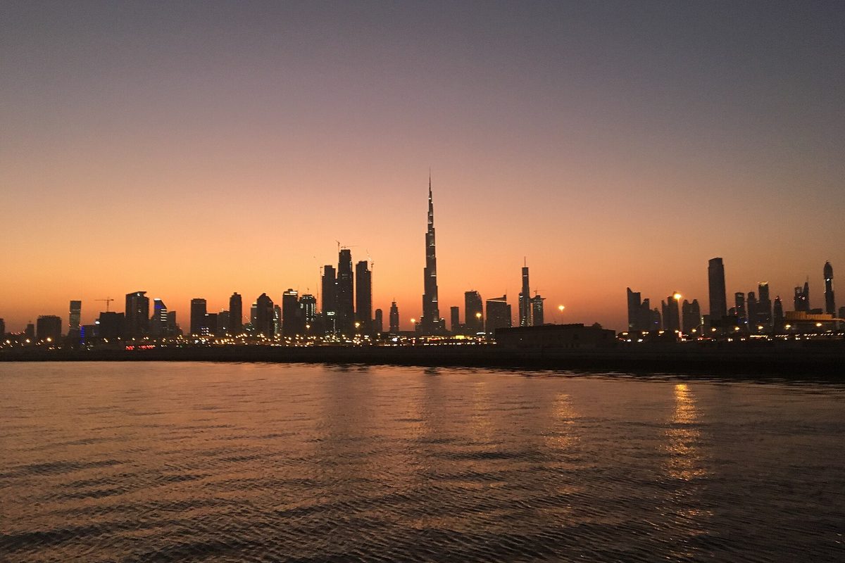 Burj Khalifa and Downtown Dubai skyline at sunset